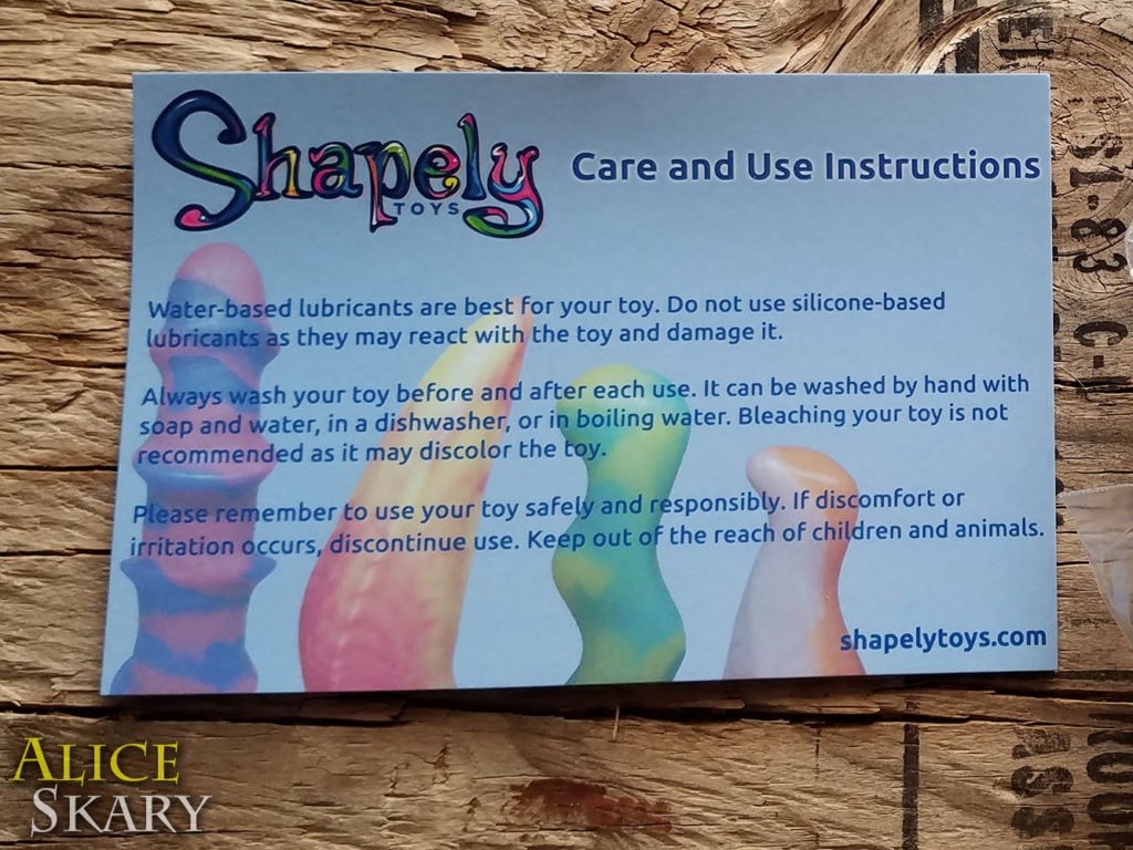 Pictured is a postcard with Care Instructions for The Rhombus buttplug from Shapely Toys